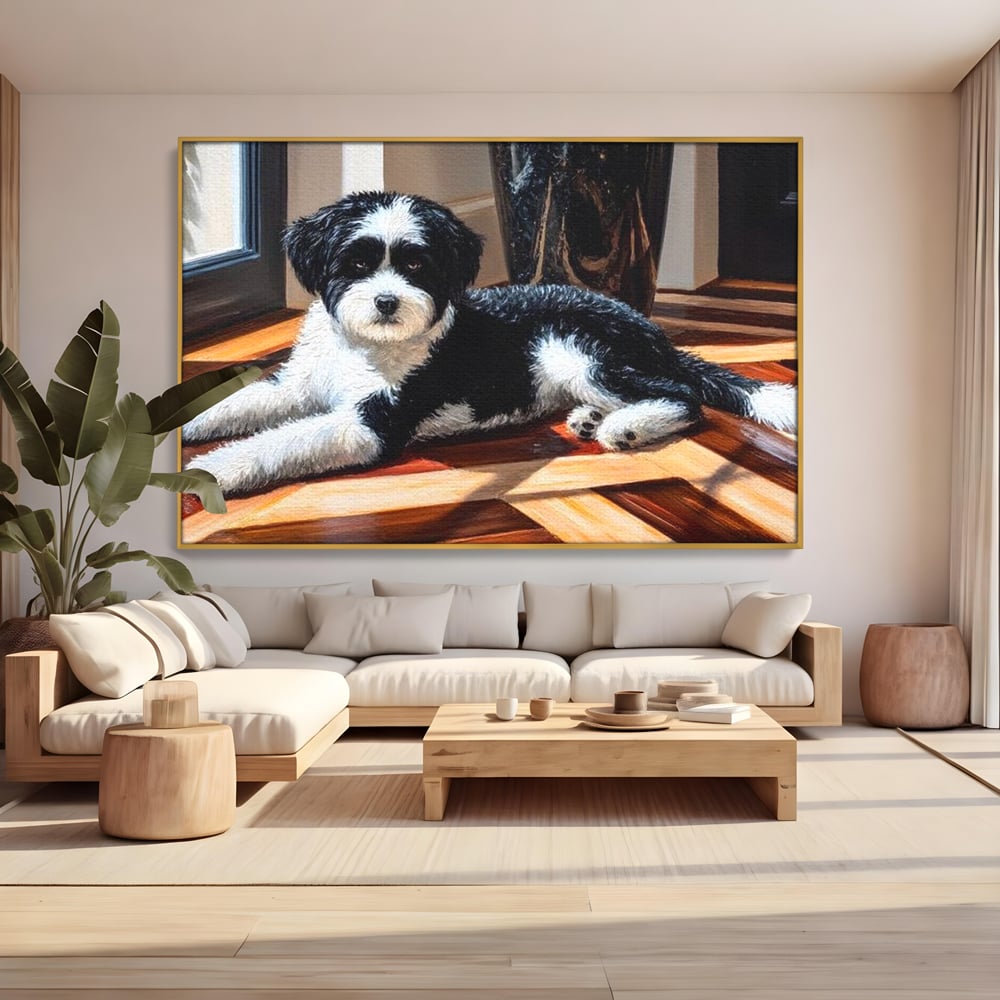 Tablou canvas cu tablou canvas cu catel negru cu alb, in rama de aluminiu auriu, pe perete intr-un living